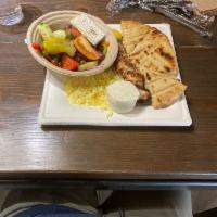 Souvlaki Plate · Choice of skewer with side Greek or village salad, french fries, grilled pita and house made...