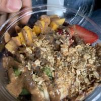 Almond Acai Bowl · Blended organic acai, banana and blueberries topped with banana, kiwi, strawberries, mango, ...