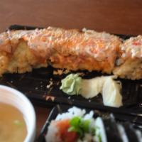 Fiji Roll · Kani, cream cheese, tempura fried, topped with spicy tuna, snow crab mix, tempura flakes, un...
