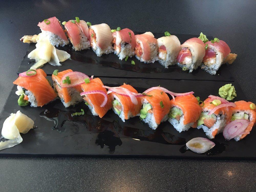 Akebono Roll · Spicy tuna, shrimp tempura, topped with yellowtail, tuna, scallions and ponzu.