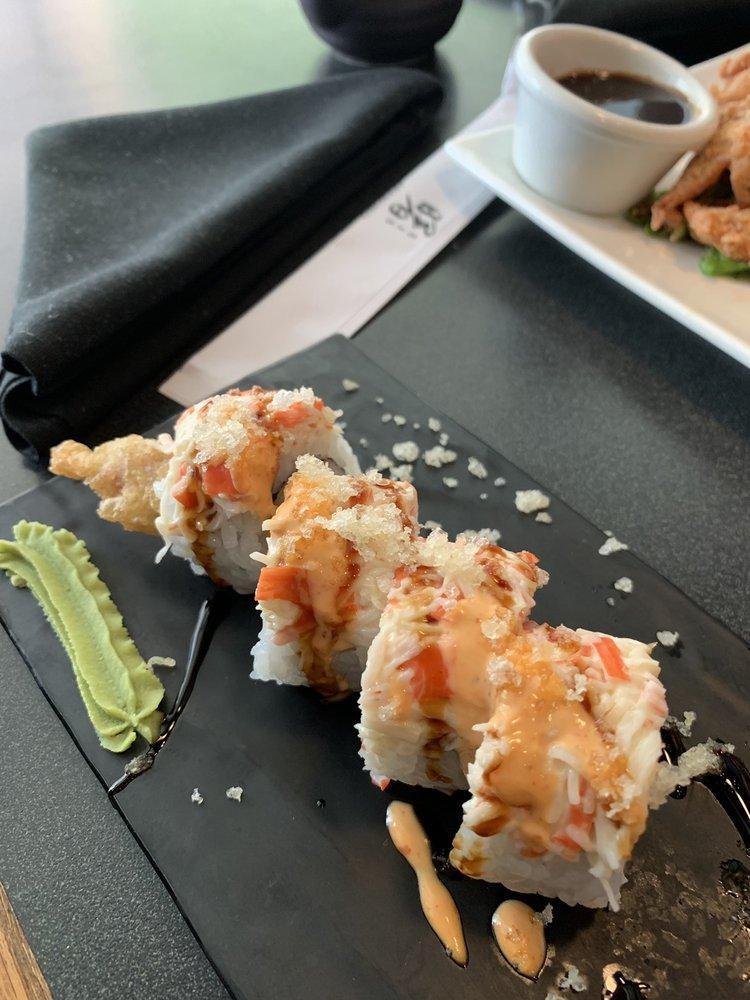 Rising Sun Roll · Shrimp tempura, kani, cucumber, topped with snow crab mix, tempura flakes, spicy mayo and unagi sauce.