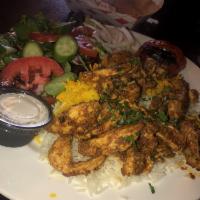 Chicken Shawarma Plate · Slices of tender chicken mixed with shawarma spices. Served with rice, salad and roasted tom...