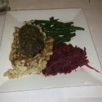 Sauerbraten · Sweet and sour pickled beef, spatzle, red cabbage and ginger snap gravy.