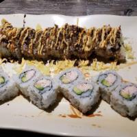Crunchy Roll · Shrimp tempura, imitation crab, avocado and cucumber roll topped with crunch, eel sauce and ...