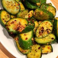 Spicy Cucumber Salad · 凉拌麻辣黄瓜 Cool  and spicy cucumber tossed in Sichuan peppercorn infused chili oil.
