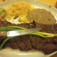 Carne Asada · The authentic thin tender steak grilled to perfection. Served with green onions pico de gall...