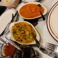 Chicken Tikka Masala · Pieces of tender boneless chicken tikka bar-b-qued in the tandoor and cooked in a delicately...