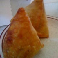 Vegetable Samosas · Two pieces. Indian pastry stuffed with delicately spiced mashed potatoes. Vegetarian. Served...