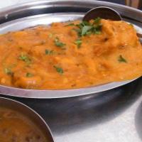Chicken Korma · Tender pieces of marinated chicken spiced mildly and cooked with onions, yogurt and assorted...