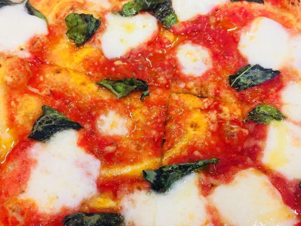 Margherita Pizza · Mozzarella and basil.