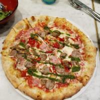 Calabrese Pizza · Meatball, Italian sausage, prosciutto cotto, mozzarella, and chili with salsa verde.