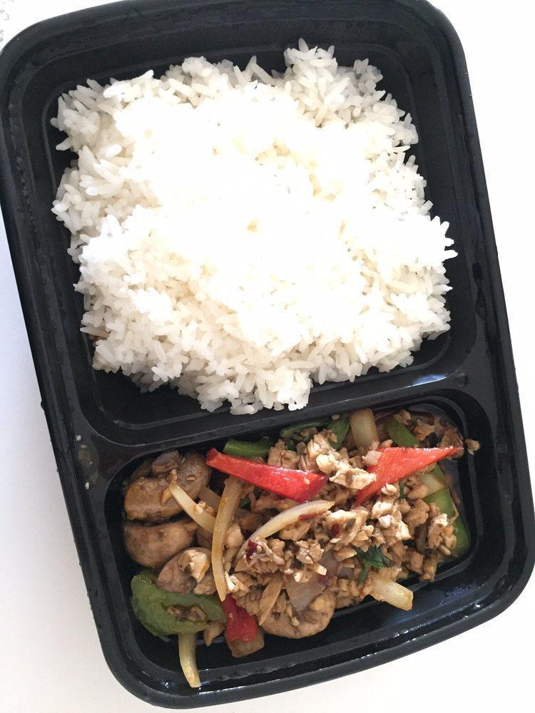 Spicy Basil · Thais like it hot! A famous street spicy dish with stir-fried meat, mushrooms, onions, bell peppers, garlic and basil leaves. Served with steamed rice.