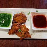 Vegetable Pakora · Crispy goodness. Mix vegetables and spices in chickpea flour, fried to perfection (fritters)...