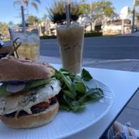 Grilled Chicken Burger · Black bean puree, avocado, roasted tomatoes, radish and almond butter miso aioli.