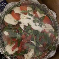 Caprese Salad · Spring mix, tomatoes, fresh mozzarella and roasted peppers. Dressing on the side.