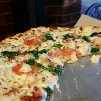 Alfredo Pizza · Alfredo sauce, fresh tomatoes, spinach, bacon, chicken, Parmesan shredded and mozzarella che...
