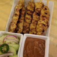 Satay · Marinated fresh tender pork or white chicken breast barbecued and served with peanut sauce a...