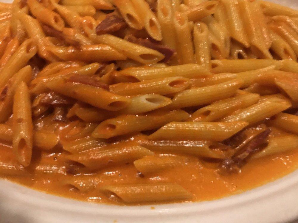 Penne Vodka · Vodka, cream, touch of scallions, prosciutto, tomatoes and Parmigiano cheese.