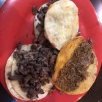 Mulita · 2 corn tortilla with choice of cheese and the meat of your choice in between.