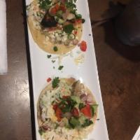 Fish Tacos · Cajun-seared haddock, apple slaw, avocado crema and cilantro on fresh corn tortillas, served...