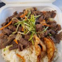 Beef Bulgogi · Stir-fried beef bulgogi with vegetables and bowl of rice. Make it spicy for an additional ch...
