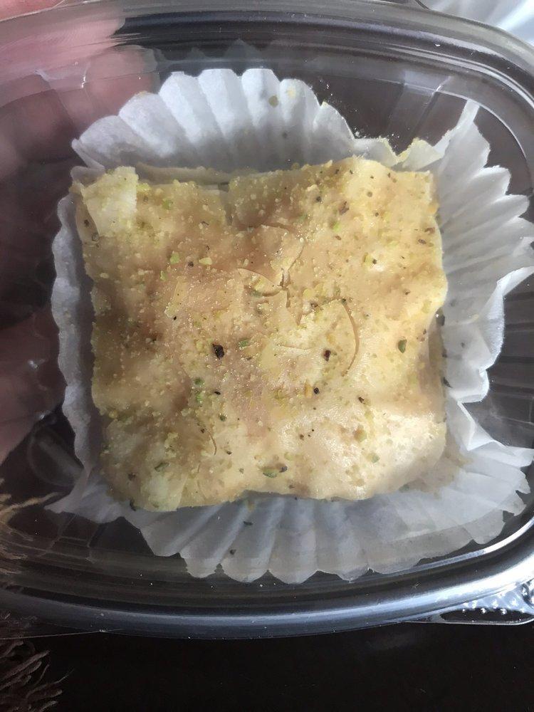 Baklava · Rich, sweet pastry made of layers of filo filled with chopped nuts and sweetened and held together with syrup and honey.