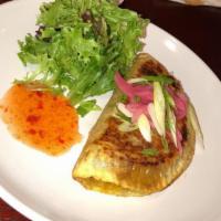 Half Moon Turnover · Curried chicken, onion, potato, oyster sauce, wrapped in paratha. Served with Thai-style pic...