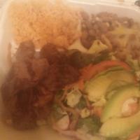 Carne Asada Plate · Grilled carne asada and grilled onions served with a side of rice, beans, salad and avocado ...
