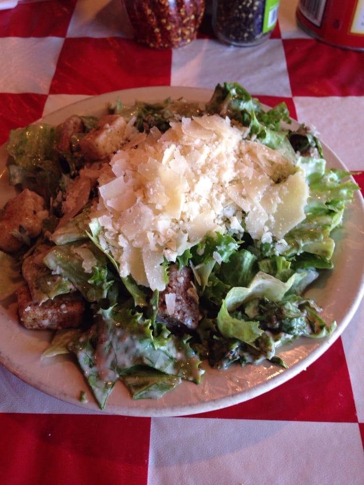 Caesar Salad · A Roman classic with leafy greens, shaved Parmesan cheese and croutons. Tossed in classic Caesar dressing.