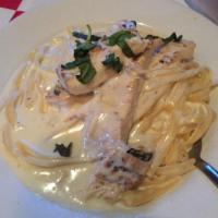 Fettuccine Alfredo · Served with small house salad.
