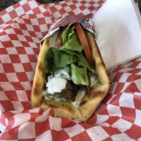 Gyros Sandwich · Grilled gyro meat, chopped onions, lettuce and tomato with house gyro sauce on toasted pita ...