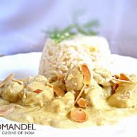 Murgh Shahi Korma · Chicken in a mildly spiced curried creamy pistachio and cashew sauce with dash of saffron. 