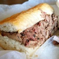 Italian Beef Sandwich · Our own homemade recipe. Thinly slice and cooked its own juice. Served on French bread. Add ...