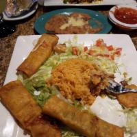 Flautas · 4 fried corn taquitos 2 shredded beef and 2 shredded chicken. Served with rice, lettuce, gua...