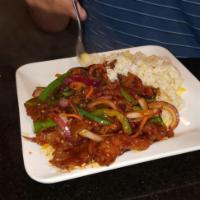 Mongolian Beef · Tender beef strips with sliced bell pepper, onion, and carrots stir fried in spicy mongolian...