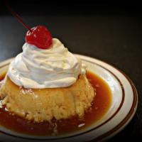 Flan · Sweet vanilla and nutty custard topped with a caramel sauce.