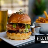 Hill Street Burger · Gruyere, bacon, blue cheese, arugula, caramelized onion, aioli, and rosemary Parmesan bun.