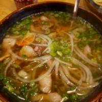 Hu Tiu · Our version of pho in house made chicken broth, topped with crispy pork belly and tiger shri...