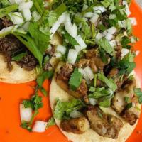 Tacos Al Vapor · Popular item. Two small soft tortillas, choice of meat, cilantro and onions
