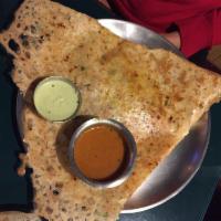 Onion Masala Dosa · 1 large rice crepe sprinkled with finely chopped onions filled with potato and onion masala....