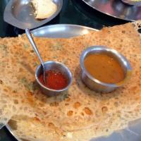 Plain Rava Dosa · 1 large crepe made from cream of wheat sprinkled with cumin and corriander leaves, Served wi...