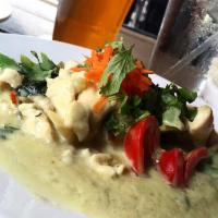 Green Curry · Spicy Thai curry with coconut milk, bamboo shoots, bell peppers and basil.