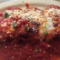 Eggplant Rollatini · Eggplant lightly breaded and fried; layered with ham, provolone and ricotta cheese; rolled u...
