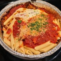 Eggplant Parmigiana · Eggplant lightly breaded, fried and baked in tomato sauce with mozzarella cheese served with...