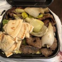 Gyros Plate · Hand carved beef and lamb. Served with rice, Greek salad, pita bread and tzatziki.