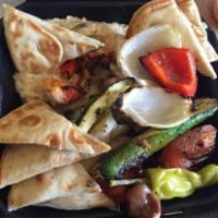 Falafel Plate · Served with rice, Greek salad, pita bread, tzatziki and hummus.