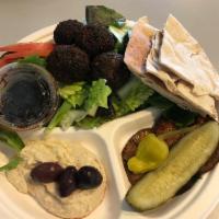 Mediterranean Plate · Greek salad, tabbouleh, hummus, pita, pickle, and pepperoncini.