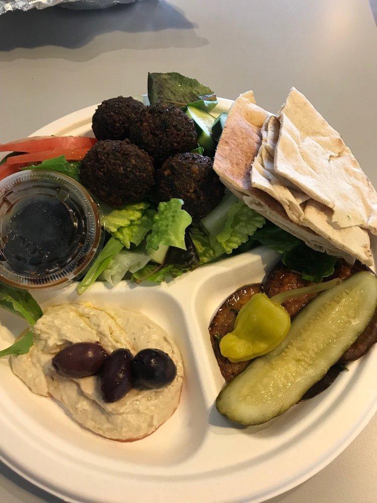 Mediterranean Plate · Greek salad, tabbouleh, hummus, pita, pickle, and pepperoncini.