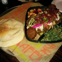 B G Platter · Basmati rice topped with steak and chicken shawarma and gyro, falafal , quinoa tabouleh, hum...