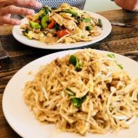 Pad Thai Noodles · Stir-fried rice noodles with tofu, eggs, ground peanut, green onion, and bean sprouts in lig...